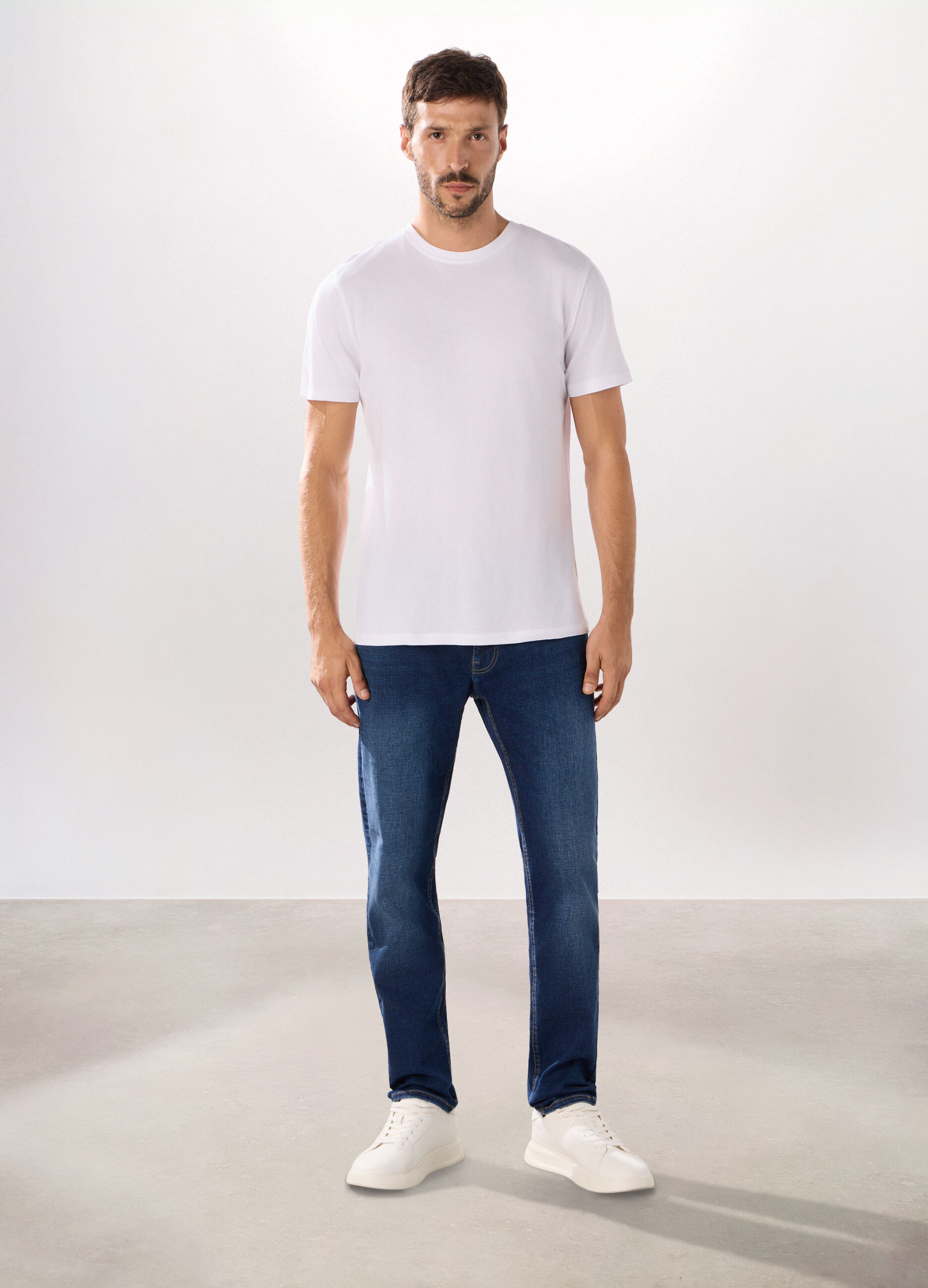 Jeans 5 tasche in denim di cotone stretch uomo_0