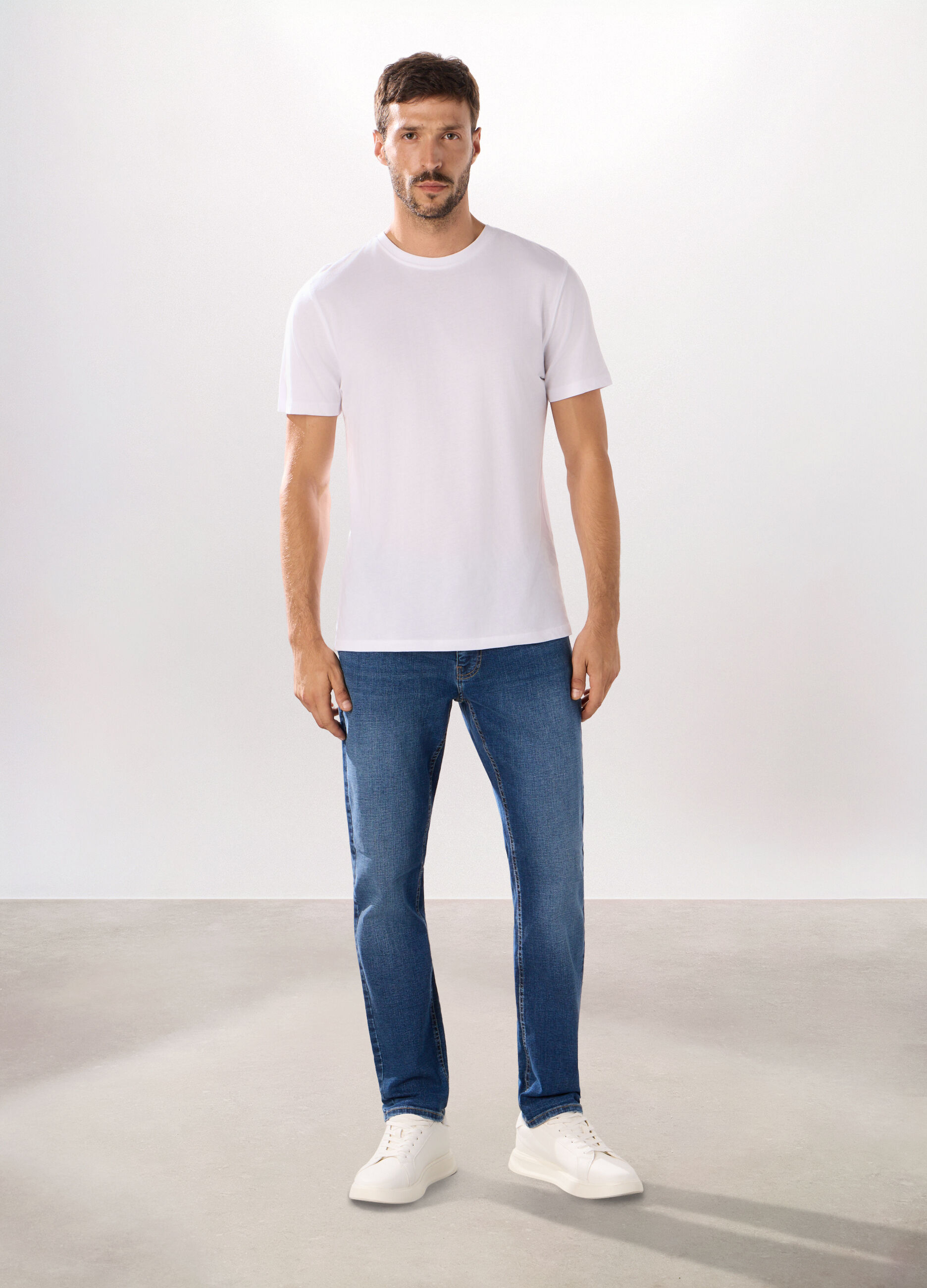 Jeans 5 tasche in denim di cotone stretch uomo_0